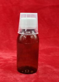 Botella quebrada del jarabe de la medicina de la prueba, envases plásticos del jarabe con la taza de medición